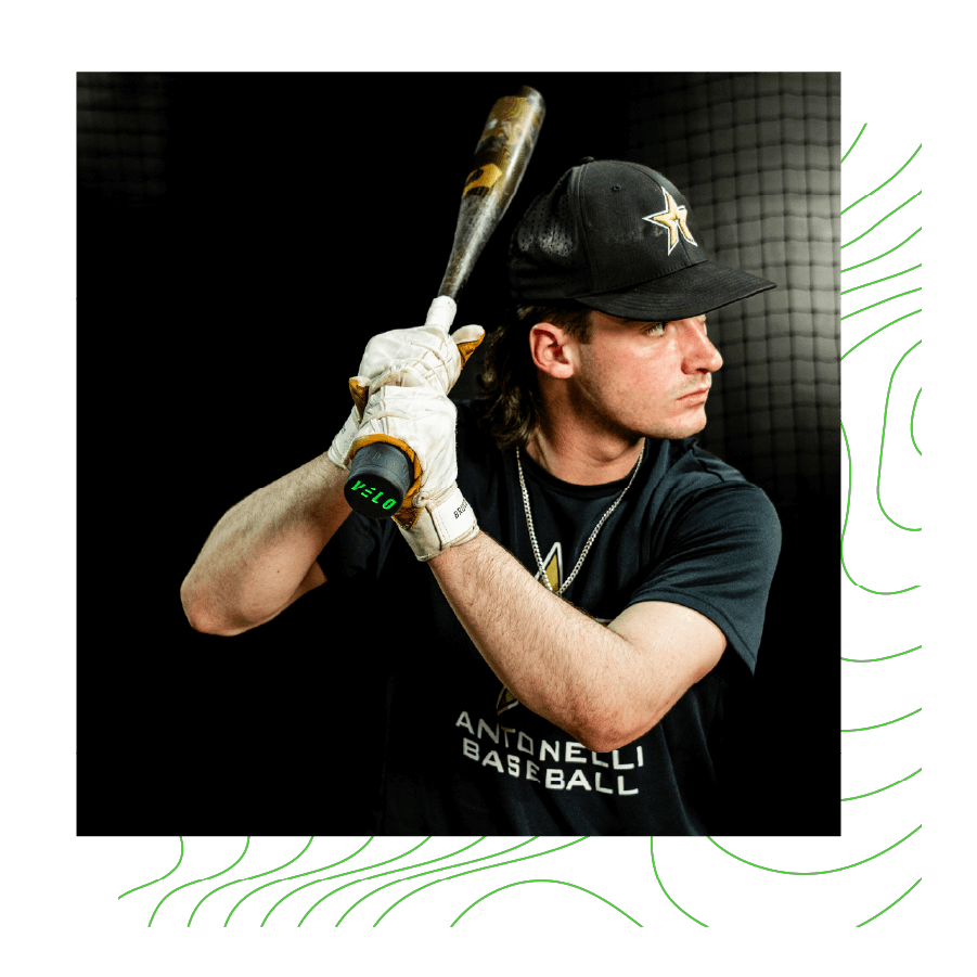 College Antonelli Baseball player posing with bat and attached VELO Puck